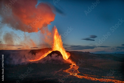 Reykjanes Peninsula, Iceland - May 9th 2021: Geldingadalir eruption at sunset with lava explotion photo