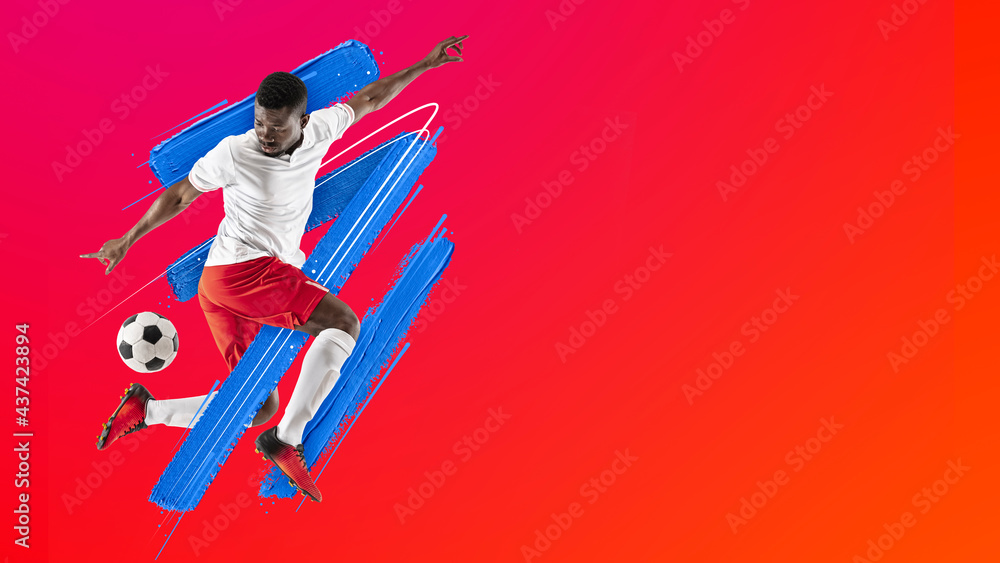 Art collage. Young man, soccer footbal player training isolated in neon light on red background. Watercolor paints. Concept of sport, game, action.