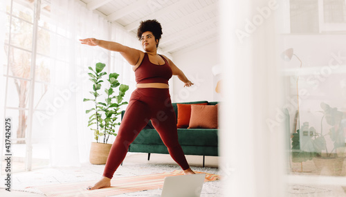 Healthy woman doing exercise at home
