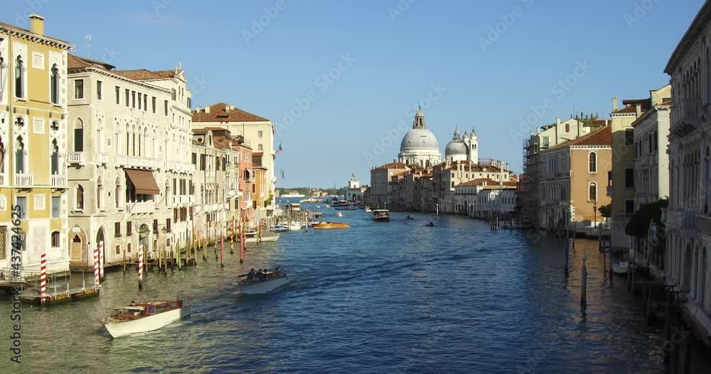 Venice, Italy. Boats in the Grand Canal with Basilica di Santa Maria della Salute in the background. Venice, Italy. Boats in the Grand Canal with Basilica di Santa Maria della Salute in the background.