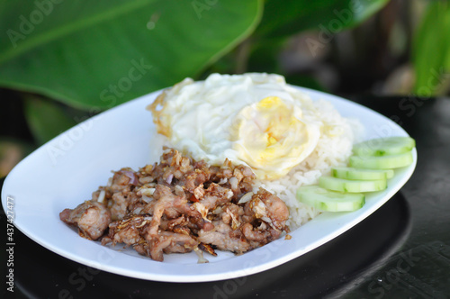 Rice with stir fried pork with garlic, stir fried pork with sunny side up egg