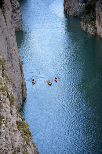 Congost de Mont-rebei gorge, in the Montsec mountain range, with some kayaks on the Noguera Ribagorzana river and the Canelles reservoir (Lleida province, Catalonia, Spain, Pyrenees) photo