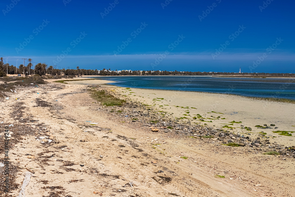 Beautiful view of the bay of the Mediterranean Sea at low tide on the island of Djerba, Tunisia