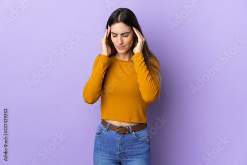 Young caucasian woman over isolated background with headache