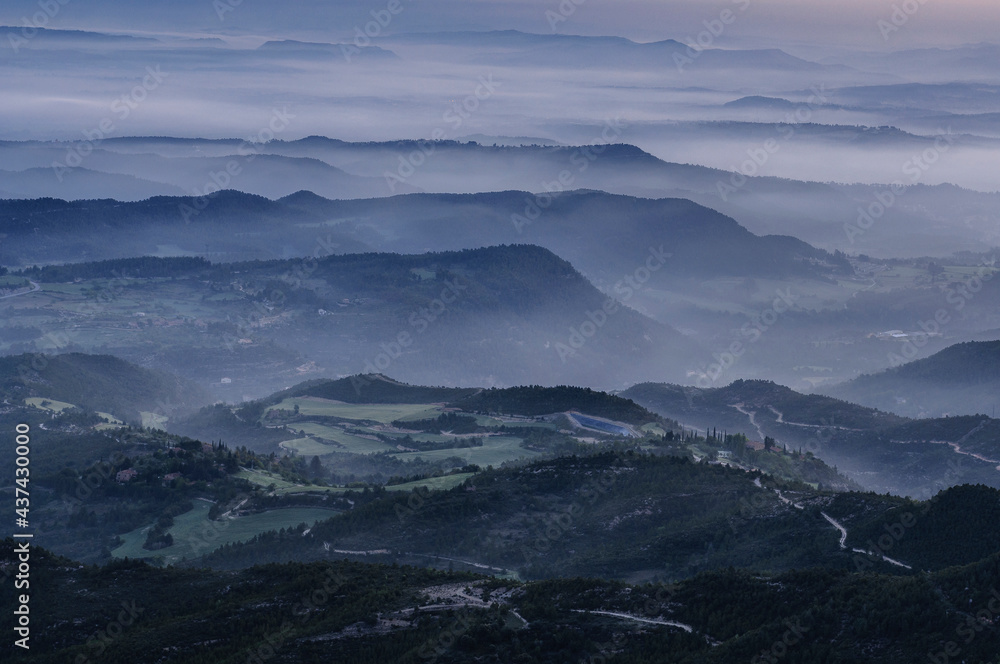 Morning mists over Pla de Bages at sunrise, seen from the Montserrat mountain (Barcelona province, Catalonia, Spain)