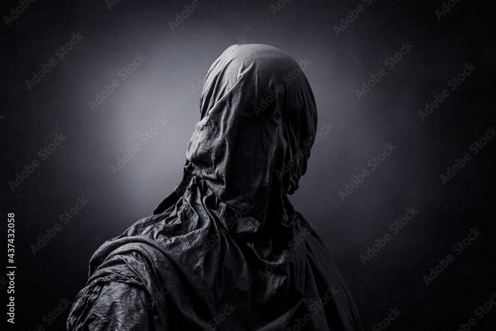 Creepy figure over dark misty background Creepy figure over dark misty background
