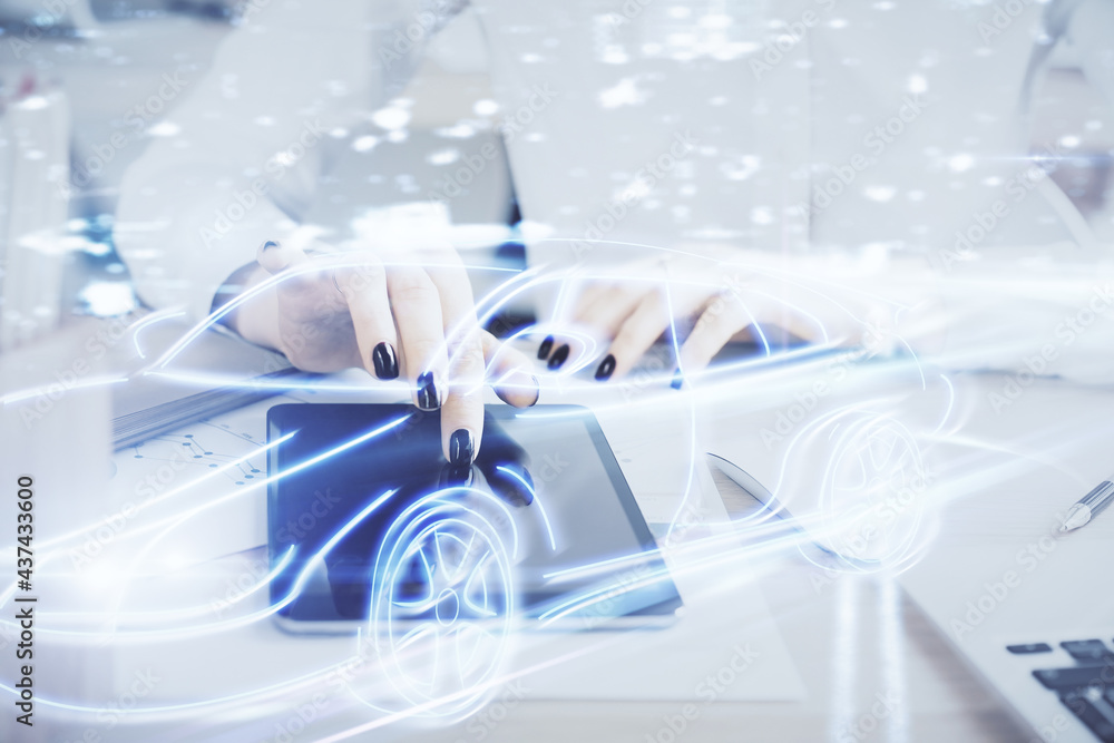 Double exposure of automobile icon hologram and woman holding and using a mobile device. Technology concept. Double exposure of automobile icon hologram and woman holding and using a mobile device. Technology concept.