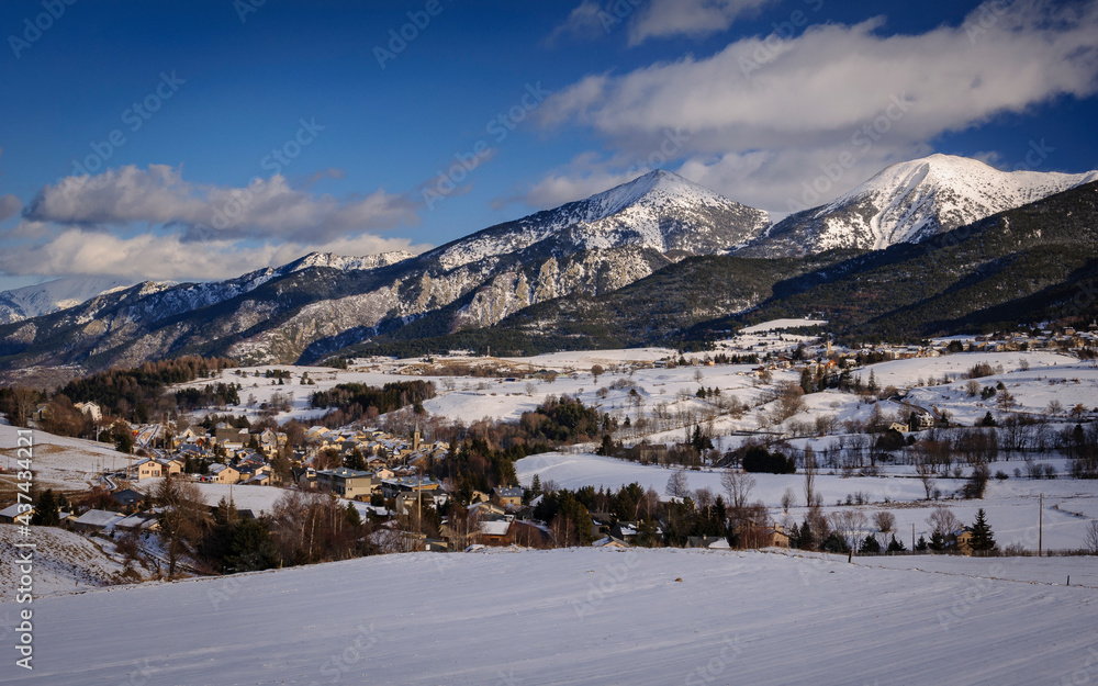 Pyrénées Orientales mountains seen from Mont-Louis village in a winter snowy day (Pyrenees Orientales, Occitanie, France)