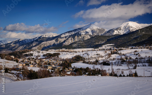 Pyrénées Orientales mountains seen from Mont-Louis village in a winter snowy day (Pyrenees Orientales, Occitanie, France) photo