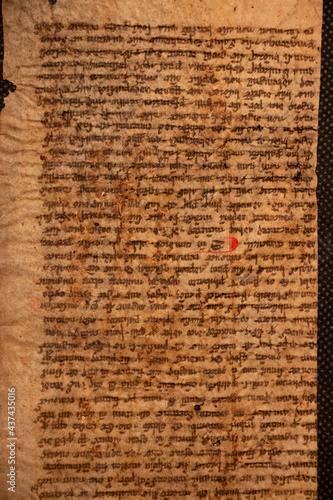 Manuscript fragment from a leaf written in medieval times on vellum or parchment. These fragments and leaves are taken from the bindings of books and were used as waste pieces. 