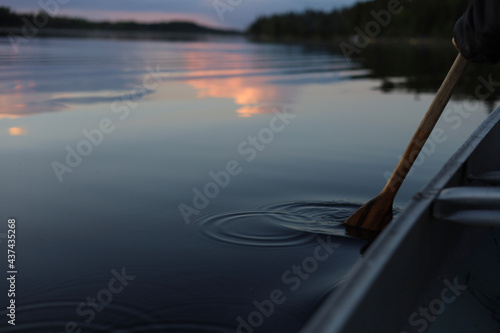 Oar in Lake Making Reflection with Clouds Reflected in the Background