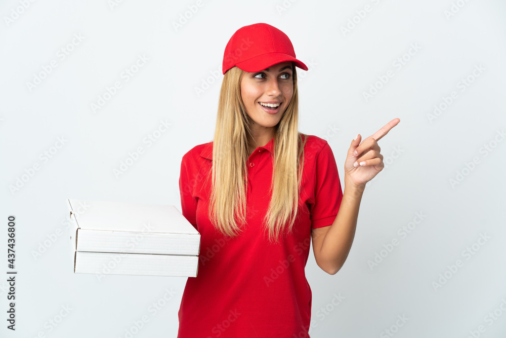 Pizza delivery woman holding a pizza isolated on white background intending to realizes the solution while lifting a finger up Pizza delivery woman holding a pizza isolated on white background intending to realizes the solution while lifting a finger up