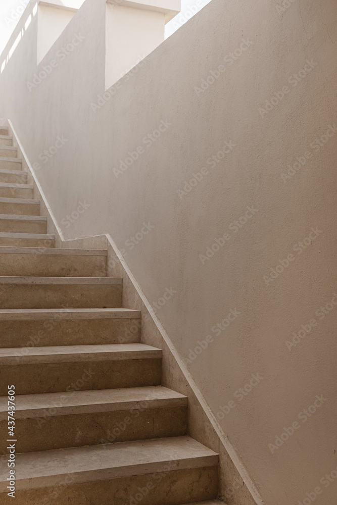 Minimal aesthetic architecture concept. Beige wall and stairs Minimal aesthetic architecture concept. Beige wall and stairs