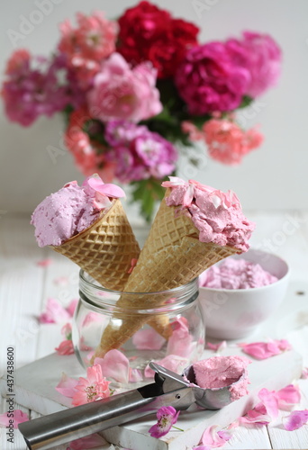 Still life with fruit ice cream and a bouquet of roses on a white background