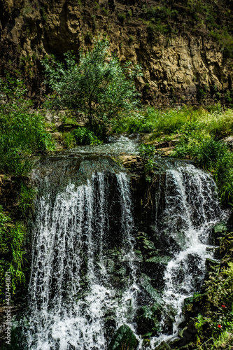 Summer landscape with waterfall