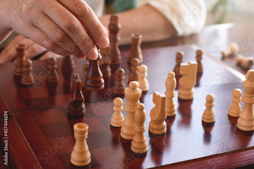 Woman is playing game of chess