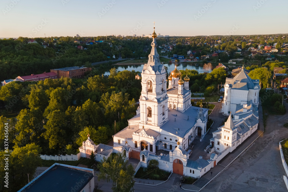 Aerial view of old monastery for men in Russia, Perm city in summer sunny day with golden dome