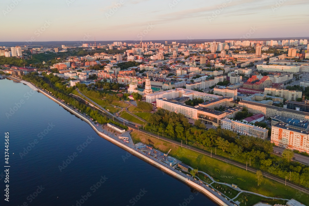 Aerial view of Perm and historical building, Kama river with bridge in sunny summer day with green trees in the sunset