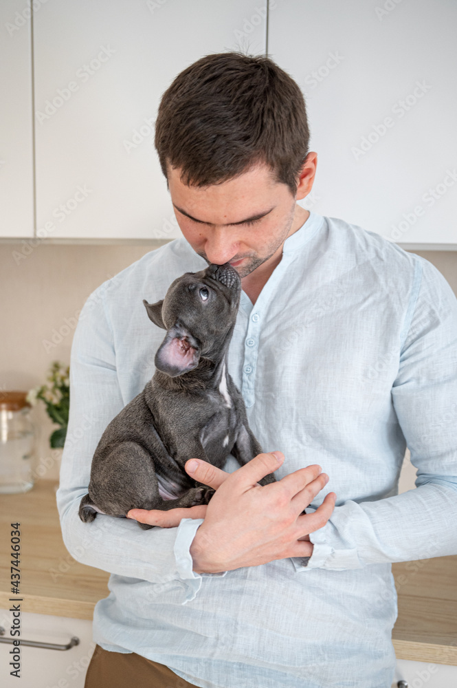 Guy with a French Bulldog kiss