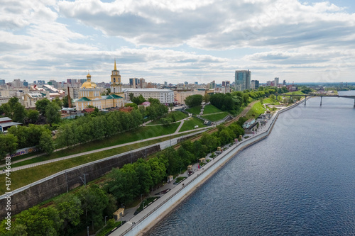 Aerial view of Perm and historical building of art gallery, Kama river with bridge in sunny summer day with green trees
