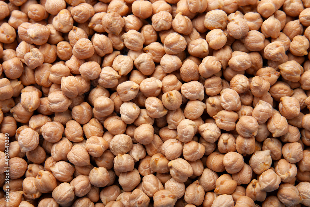 Close up view of raw chickpea beans. Chickpeas texture as background, top view