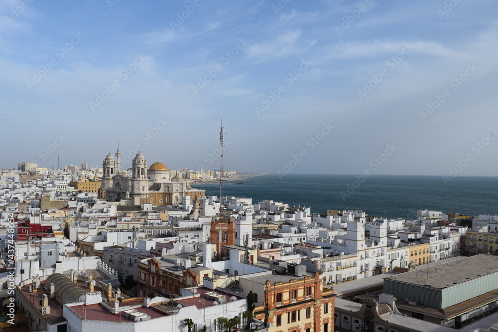 Epectacular top-view to the rooftops of the historical old city from cadiz andalusia spain europe, interesting buildings and architecture from medieval at the coastline, panoramic scene to the church