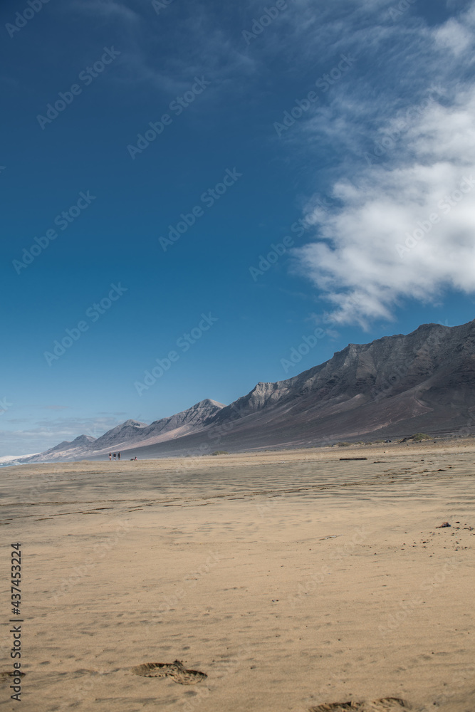 cofete beach with an expanse of mountains on a sunny day in fuerteventura cofete beach with an expanse of mountains on a sunny day in fuerteventura