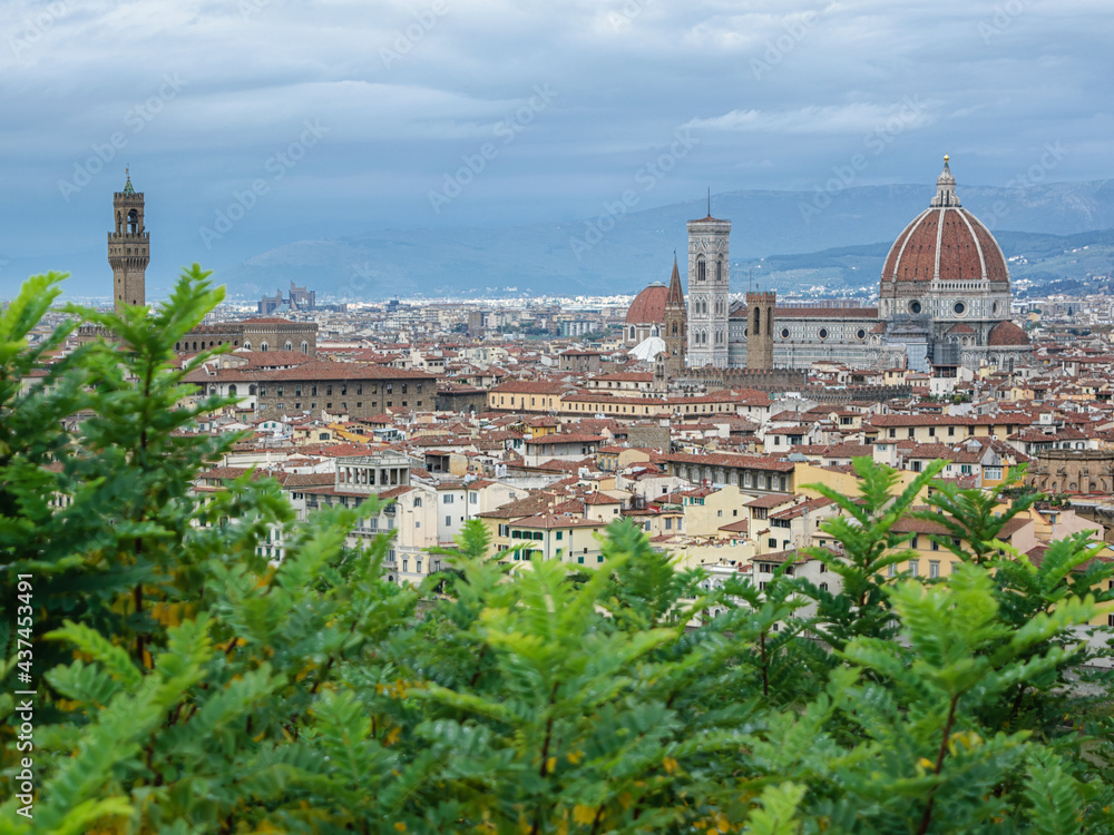 Cityscape of Florence old city seen from piazzale Michelangelo - Santa Maria del Fiore cathedral, Palazzo Veccio, cloudy day, Italy