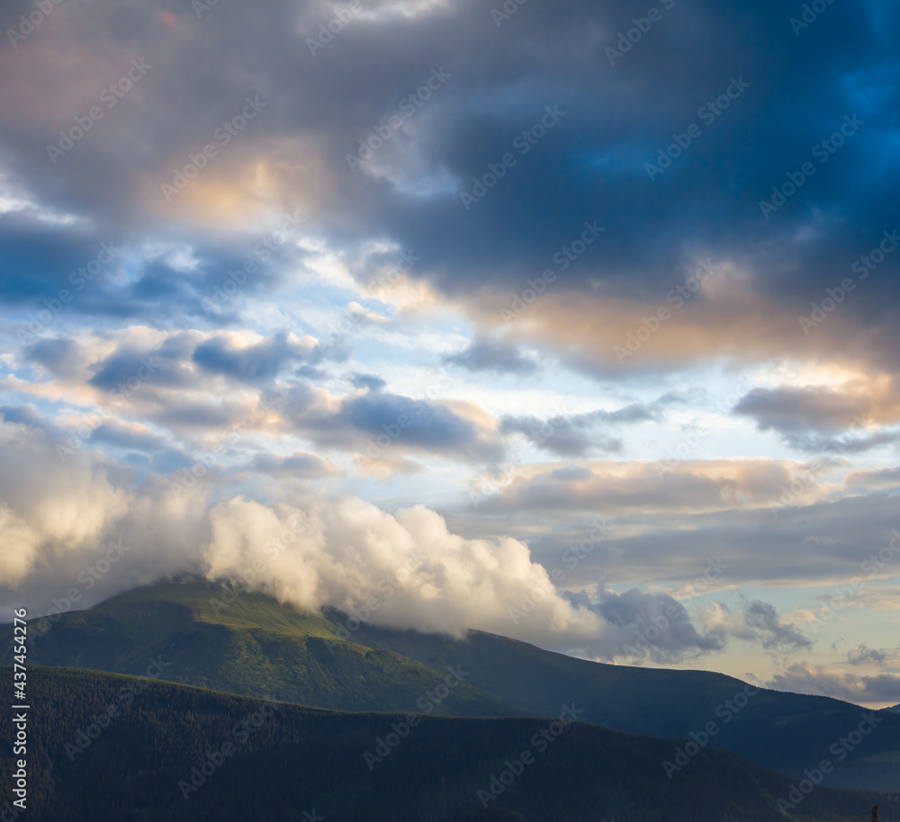 green mount top in dense cumulus clouds, outdoor background