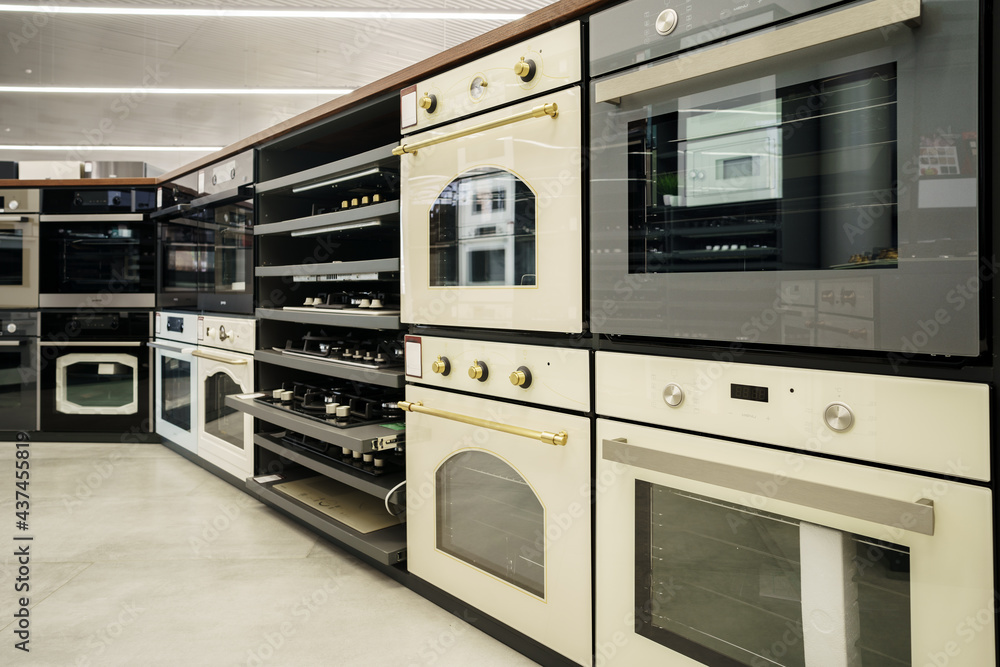 Fototapeta premium Electrical ovens, home appliances in the store..