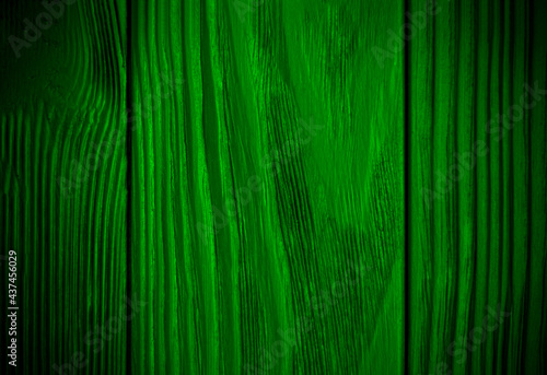 Bright green wood texture background. Abstract dark texture on green wall. Aged wood plank texture pattern in green tone. Rustic floor old wood. . High quality photo