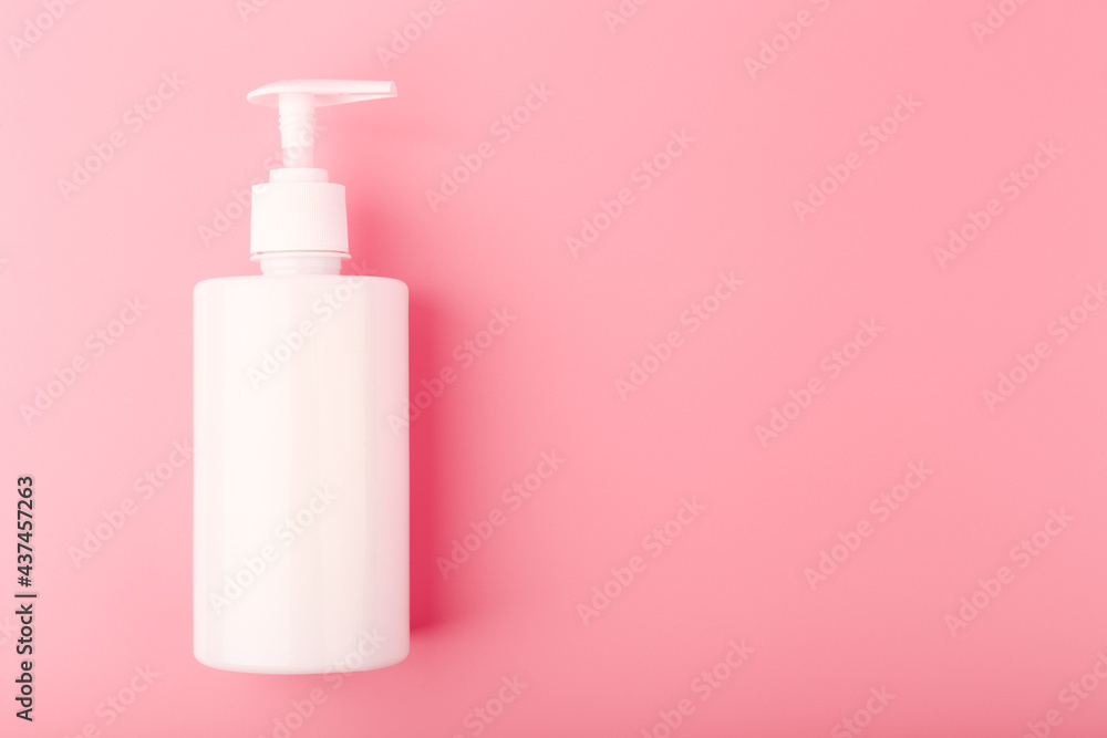 Top view of shower or intimate gel in white unbranded tube on pink background with copy space. Concept of hygiene, beauty products and pampering Top view of shower or intimate gel in white unbranded tube on pink background with copy space. Concept of hygiene, beauty products and pampering