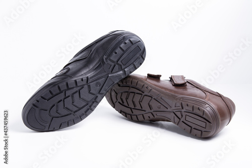 Male black and brown leather shoes on white background, isolated product.