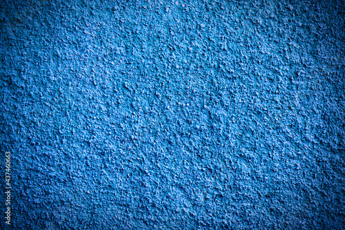 Blue grunge background with vignette. Plaster texture.