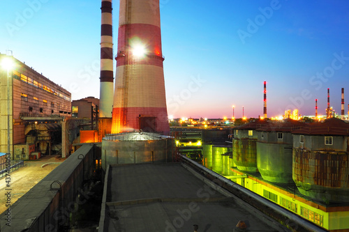 Refinery at night. Industrial zone. Factory with night light	