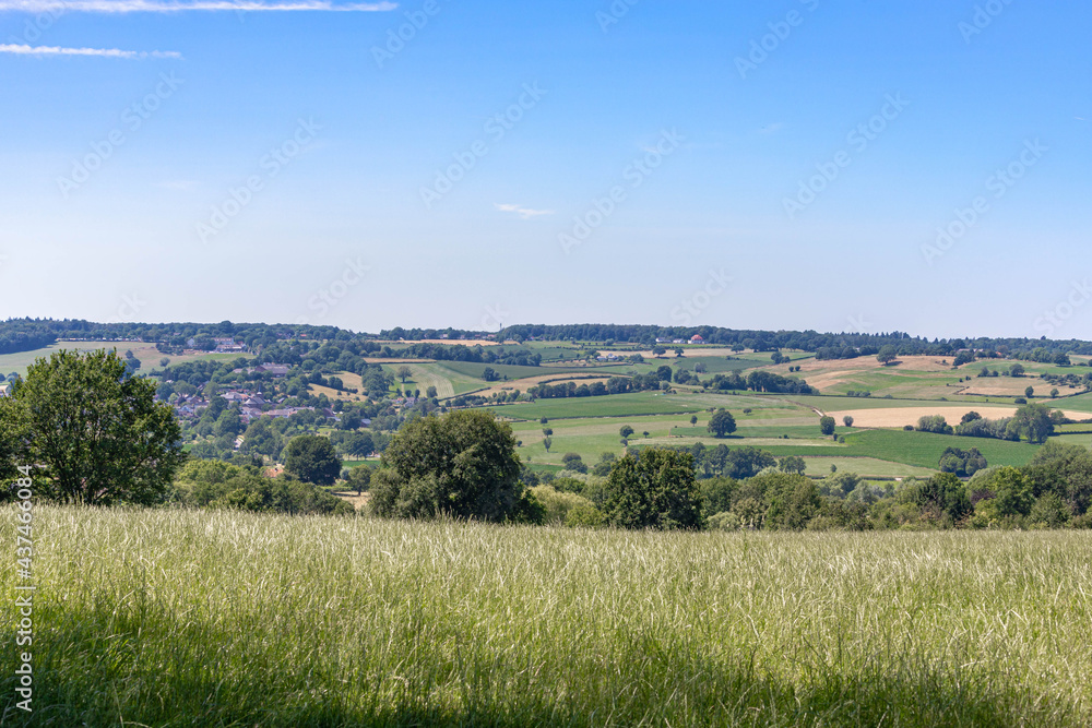 Fototapeta premium Landscape of hilly countryside of South Limburg (Zuid-Limburg) with small villages between the hill, Epen is a village in the southern part of the Dutch province of Limburg, Netherlands.