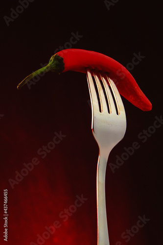 red hot chili pepper on fork