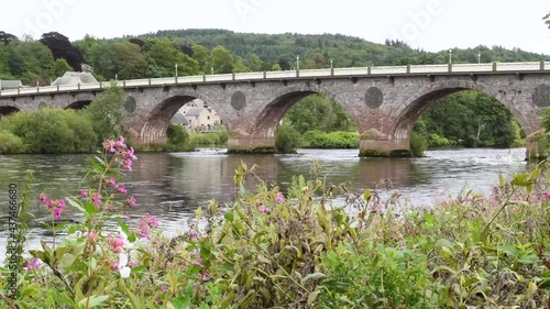 Video of Smeaton's Bridge, locally known as the Old Bridge, across the River Tay in the city centre of Perth in Scotland. Select focus on the bridge. The bridge opened in 1771. 4K Footage.