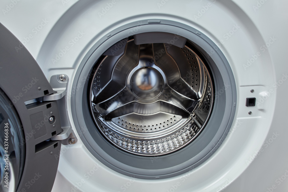 Washing machine with open door and empty drum. Washing machine with open door and empty drum.