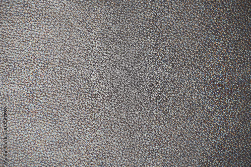 Textured surface of dark gray leatherette, leather, or dermantine. Textured surface of dark gray leatherette, leather, or dermantine.