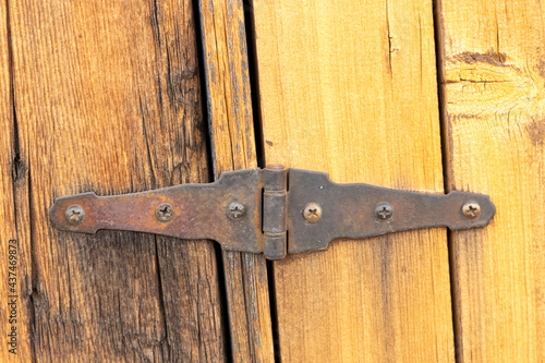 Old hinge on bard door