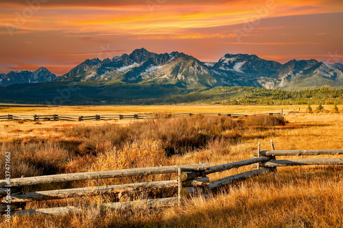 a split rail fence, pasture and meadow, and the Sawtooth Mountains near Stanley, Idaho. photo
