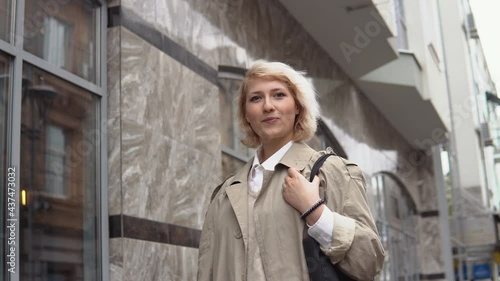 Wallpaper Mural Young blonde woman office building bag Torontodigital.ca