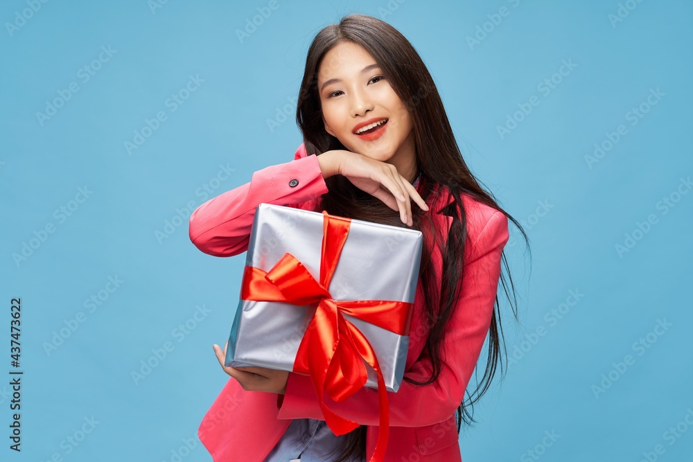 cheerful woman with a gift in her hands holiday birthday joy cheerful woman with a gift in her hands holiday birthday joy