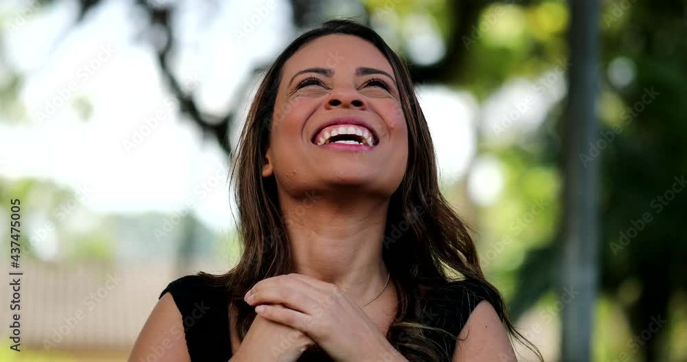 Joyful hispanic latin young woman smiling and laughing. Happy person