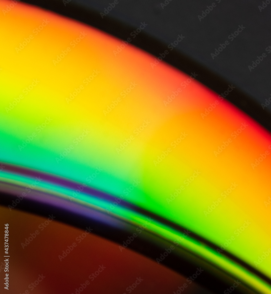 Abstract photo of the reflection of the bottom of a CD displaying a ...