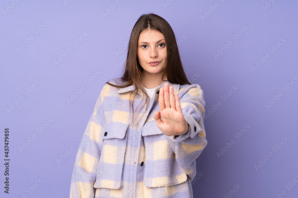 Teenager caucasian girl isolated on purple background making stop gesture Teenager caucasian girl isolated on purple background making stop gesture