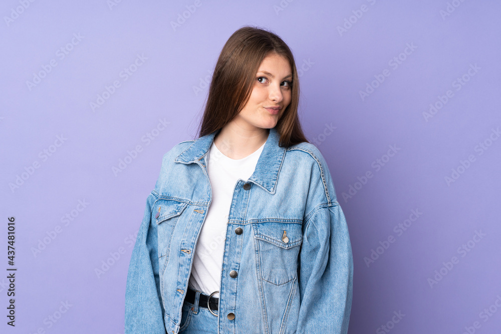 Teenager caucasian girl isolated on purple background making doubts gesture looking side Teenager caucasian girl isolated on purple background making doubts gesture looking side