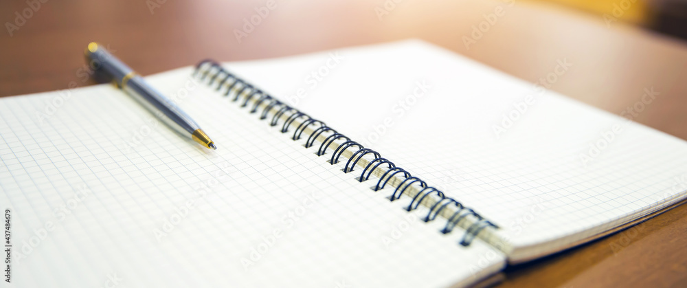 Close-up notebook or note book diary with a pen or pencil on top view desk or boardroom table for meeting notes. Close-up notebook or note book diary with a pen or pencil on top view desk or boardroom table for meeting notes.