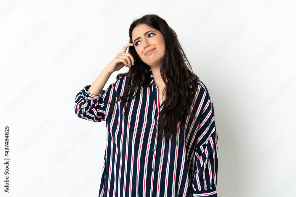 Young caucasian woman over isolated background making the gesture of madness putting finger on the head Young caucasian woman over isolated background making the gesture of madness putting finger on the head